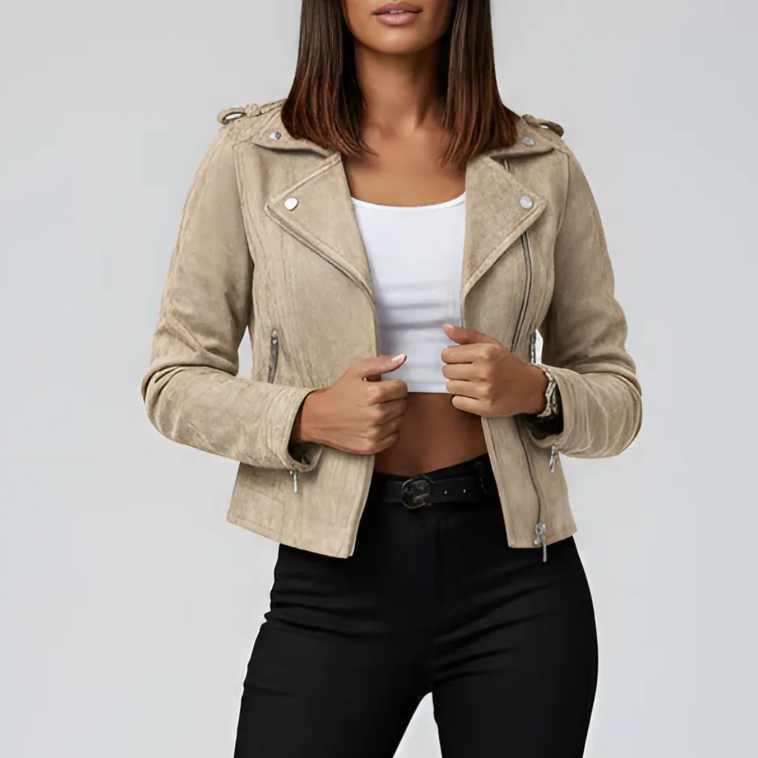 Beieg suede jacket worn by a women on a plain background